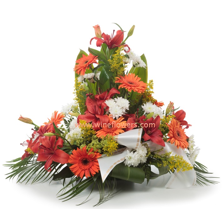 Funeral arrangement of roses lilies and gerberas