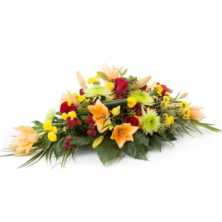 funeral spray with lilies and red roses